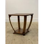 A 1930's Art Deco walnut lamp table, the square top with canted corners raised on four bowed