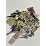A large collection of vintage costume jewellery including paste pearls, gilt metal chains, paste set