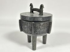 A Chinese cast metal bronze style Ting ritualistic censor and cover ice bucket with archaic style