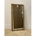 A 20thc decorative gilt composition mirror. (90cmx46cm)