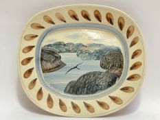 A large squared-oval James Campbell earthenware studio pottery dish decorated with scene of a