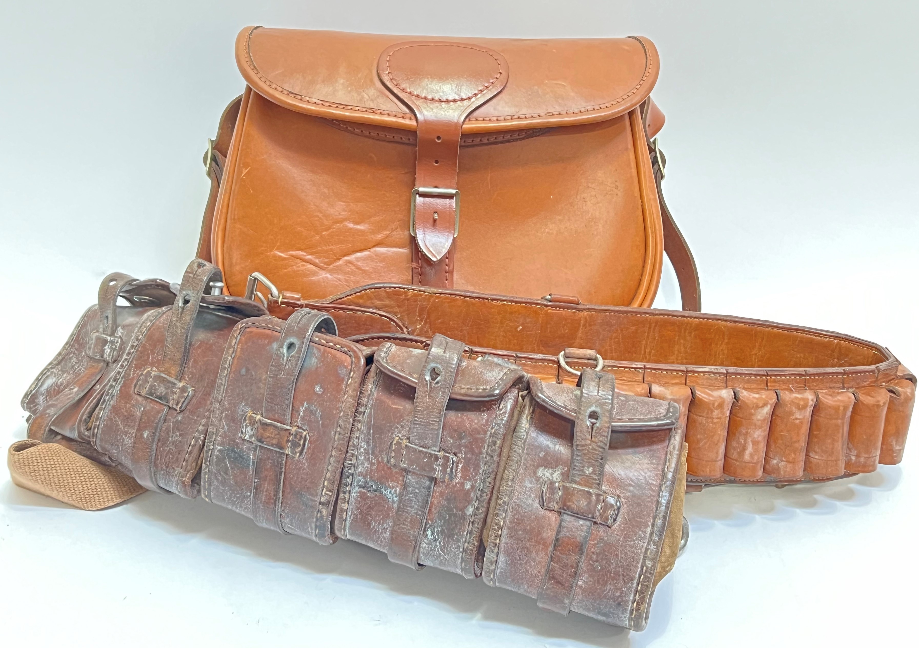 A WWII leather military ammunition belt, together with a leather military style bag and another