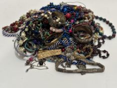 A large collection of costume jewellery including two gold plated bracelets, bead necklaces,