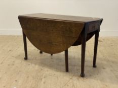 An 18th century drop leaf table, the oval top above a drawer to each end, above turned supports with