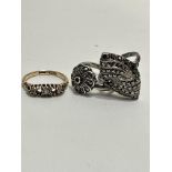 A 18ct gold ring set three diamond points missing two stones, 3.2g and two white metal marquisette