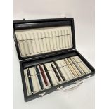 A modern pen case containing a collection of four Vintage Parker plastic coloured cased fountain