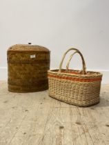 A woven reeded lidded basket of oval outline, together with two small wicker baskets (3)