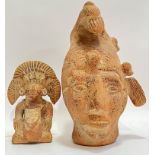 A large pre-Columbian style earthenware sculpture/bust (h- 32cm), together with another pre-