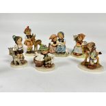 A collection of six German Hummel pottery figures including the Little Goat Herd, (Tallest H x