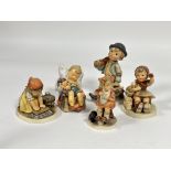 A group of five German Hummel pottery figures including, Mothers Helper, Big House cleaning, Just