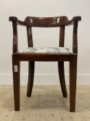 A mid 20th century stained beech tub chair, with upholstered drop in seat pad, raised on square