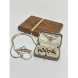 A Olive wood pull out top card case, (Lx 10cm), a Birmingham silver coil guard chain with lobster