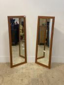 A pair of mid century style teak framed wall hanging mirrors 108cm x 41cm