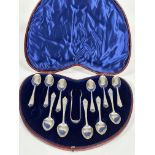 A Edwardian set of twelve plated engraved tea spoons and tongs with engraved initials LB in original