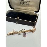 A Edwardian 9ct gold bar brooch, with pear shaped Amethyst and seed pearls compete with safety