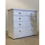 A 19th century white painted pine chest fitted with two short and three long drawers, on a plinth