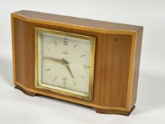 A Elliot blonde mahogany satinwood banded, mantle clock retailed by Laing of Glasgow, with silver