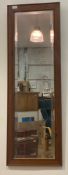 A pine framed wall mirror with beveled plate 43cm x 127cm