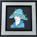 An Art Deco mirror with a textile study of a 1930's woman to centre (37.5cmx37.5cm)