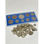 A pre decimal 1953 Queen Elizabeth II uncirculated set of coins and a collection of silver three