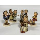A collection of five German Hummel pottery figures including, Home from Market, Birthday Serenade,