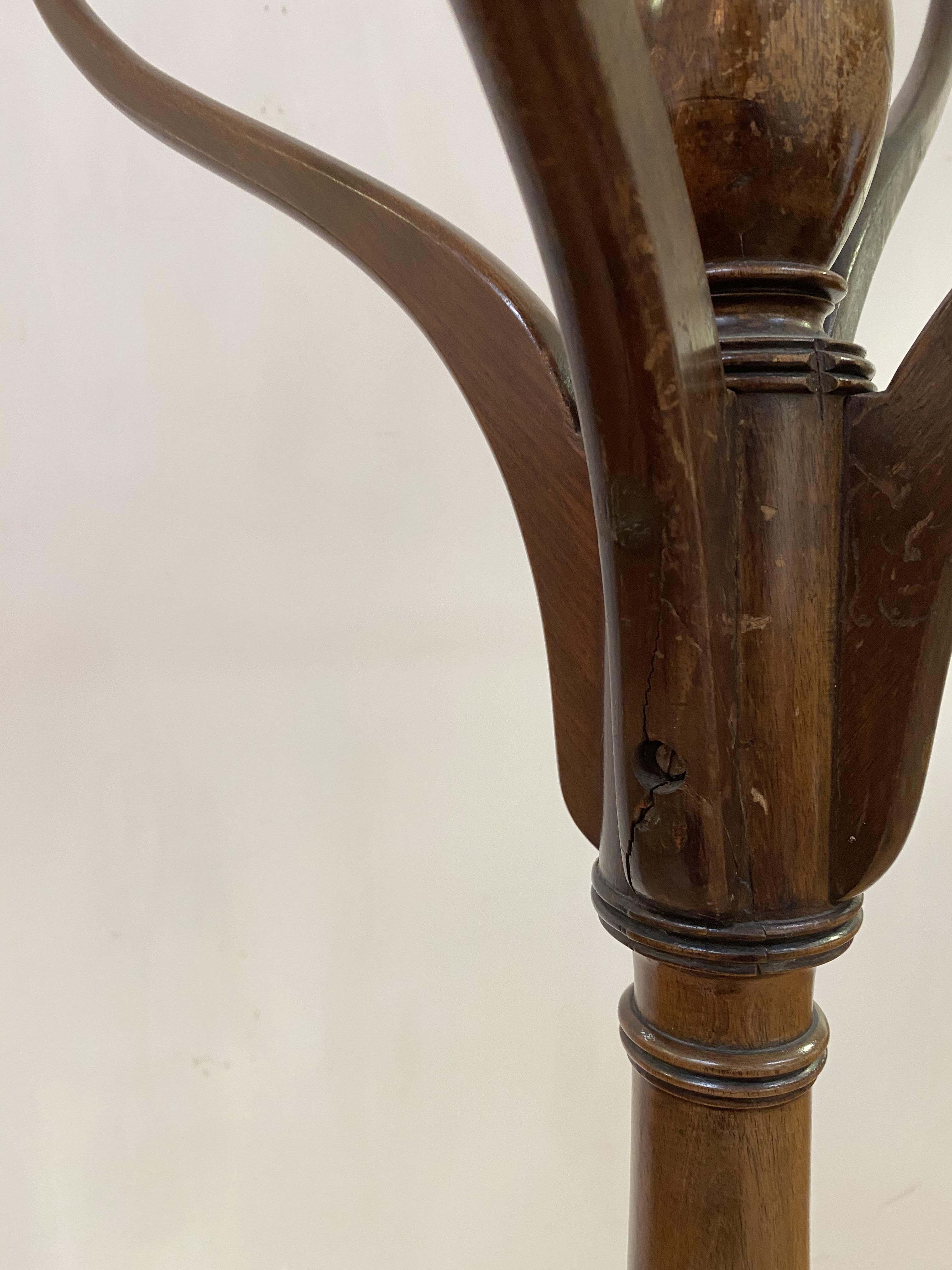 A 19th century mahogany hall stand, the ring turned column issuing six coat hooks, all standing on - Image 2 of 3