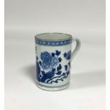 A Kangxi blue and white porcelain tankard, late 18th century, of cylindrical form, decorated with