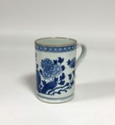 A Kangxi blue and white porcelain tankard, late 18th century, of cylindrical form, decorated with