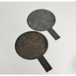 Two Japanese bronze hand mirrors, Meiji period, c. 1900, each decorated in relief with cranes and