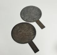 Two Japanese bronze hand mirrors, Meiji period, c. 1900, each decorated in relief with cranes and