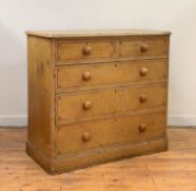 A mid 19th century painted pine chest of two short and three long graduated drawers, scumbled to