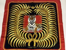 Hermes - a Royal Tiger pattern silk scarf, against a black ground within a black frame, boxed.
