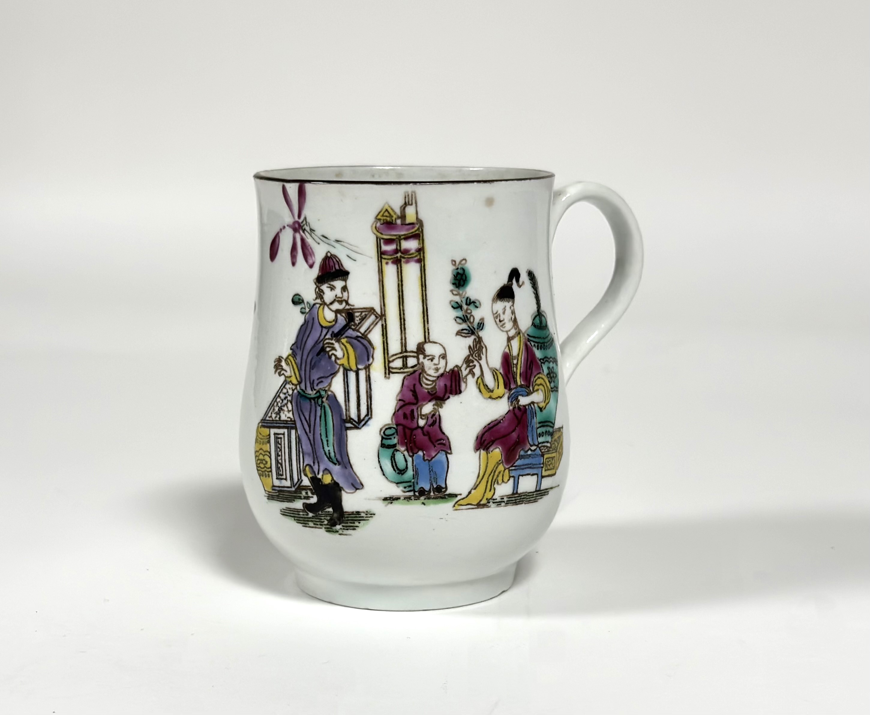 A Bow porcelain mug, c. 1755, of baluster form, painted in polychrome enamels with a Chinese