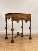 A William and Mary oak lowboy, of pegged construction, the rectangular top with a moulded edge