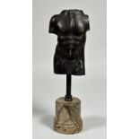 After the Antique, a patinated bronze male torso, 20th century, mounted on a faux marble plinth.