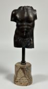 After the Antique, a patinated bronze male torso, 20th century, mounted on a faux marble plinth.