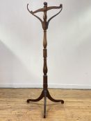 A 19th century mahogany hall stand, the ring turned column issuing six coat hooks, all standing on