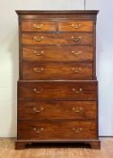 A George III mahogany chest on chest, circa 1800, the dentil cornice over two short and three long