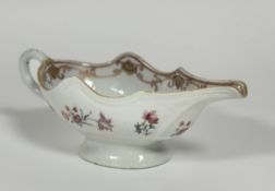 A Chinese Export porcelain armorial sauce boat, late 18th/early 19th century, the well painted