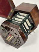 A late 19th century rosewood concertina, Rock Chidley of 135 High Holborn, London, hexagonal with