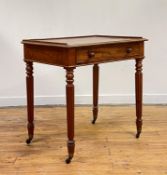 An early 19th century mahogany side table, the rectangular top with three quarter gallery above a