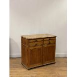 A George III satin birch writing cabinet, early 19th century, the top with moulded edge above a pull