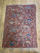 A floral kilim rug, possibly Bessarabian, early 20th century, the red field with all over stylised