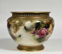 A Royal Worcester porcelain jardiniere, painted with roses and highlighted with gilding, signed by