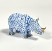 A Herend porcelain model of a rhinoceros in the blue scale pattern, printed mark. Length 12.5cm