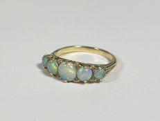 A five-stone opal ring, late 19th century, the oval-cut graduated stones spaced by eight old-cut