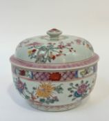A Chinese porcelain bowl and cover of kamcheng type, polychrome painted with flowering boughs and