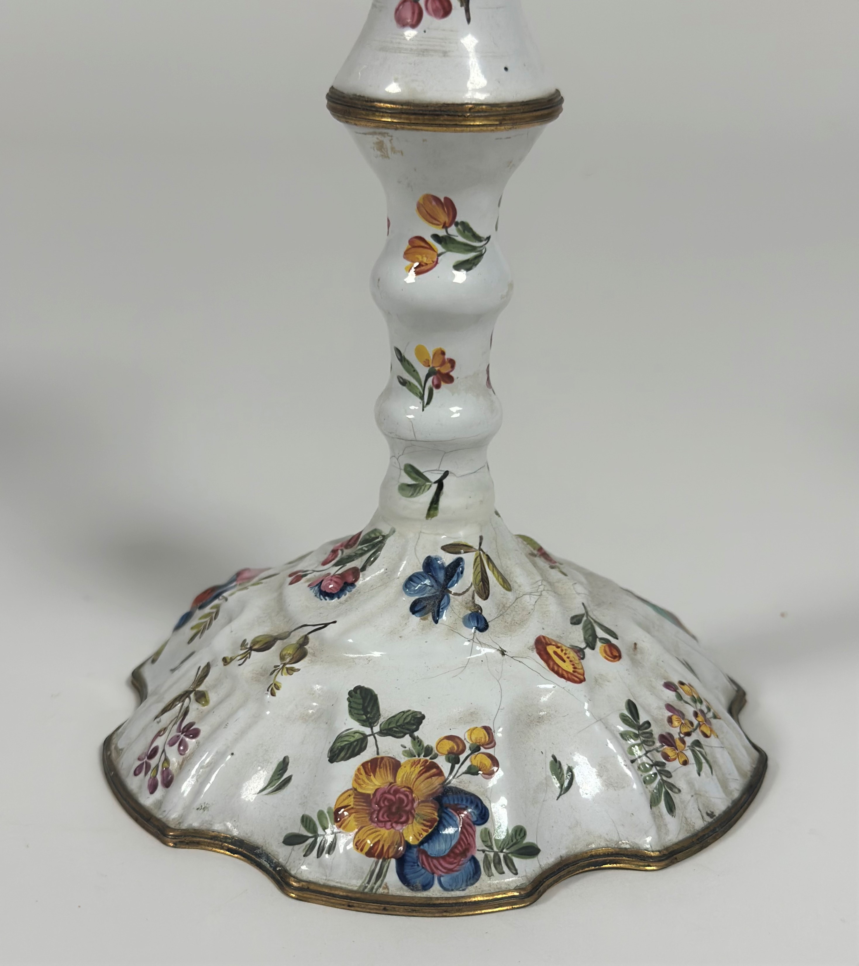 A pair of Staffordshire painted enamel candlesticks, last quarter of the 18th century, in two - Image 2 of 2