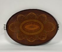 An Edwardian satinwood-inlaid mahogany twin-handled tray, oval, with brass handles, inlaid to the