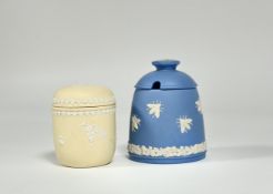 A 20th century Wedgwood jasperware jar and cover, sprigged with prunus blossom against a pale yellow